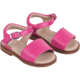 Girl wearing leather sandals with ankle strap – classic summer shoes