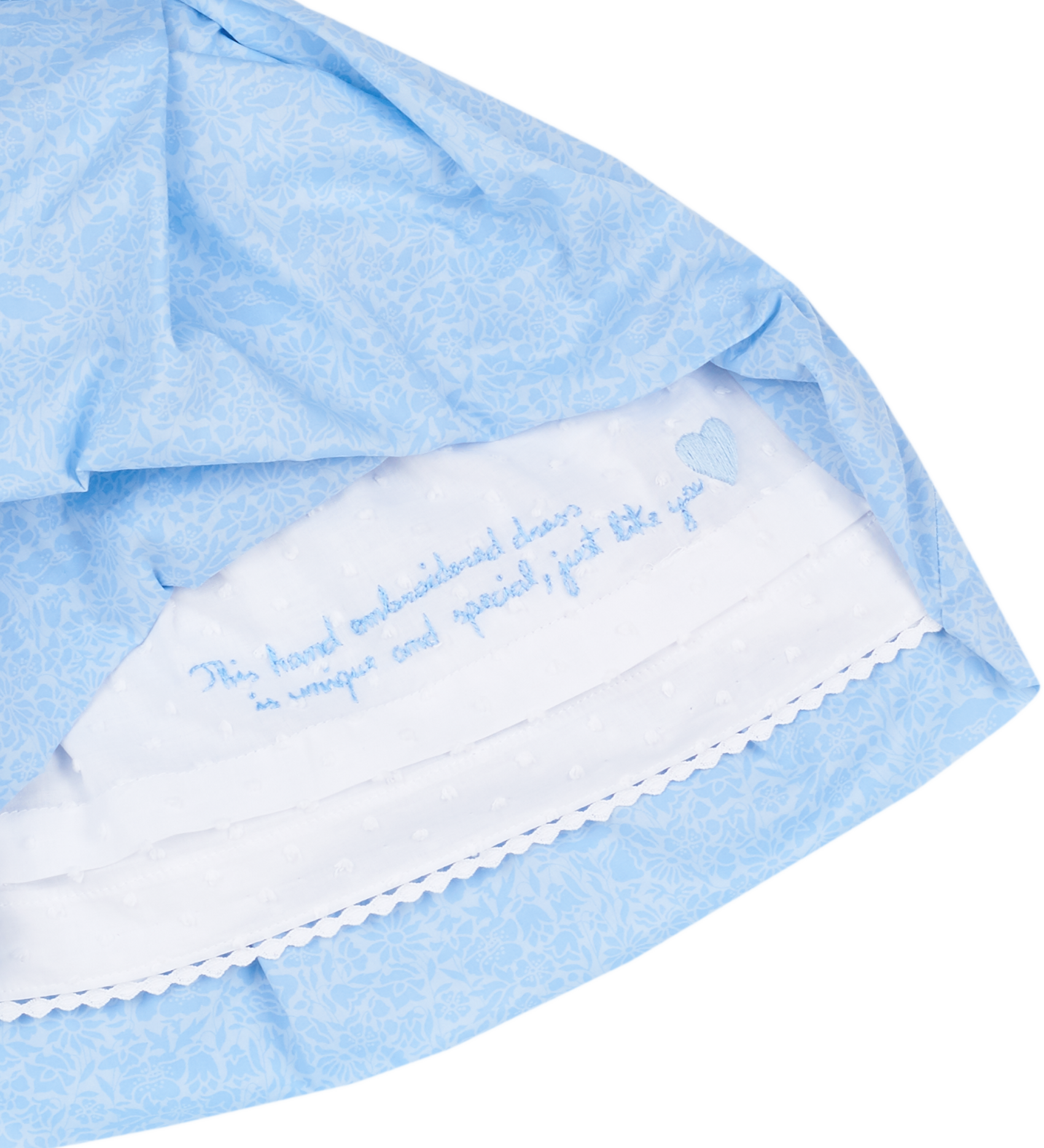 Hidden hand-embroidered message inside baby girl sky blue dress
