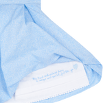 Hidden hand-embroidered message inside girls blue Liberty print dress