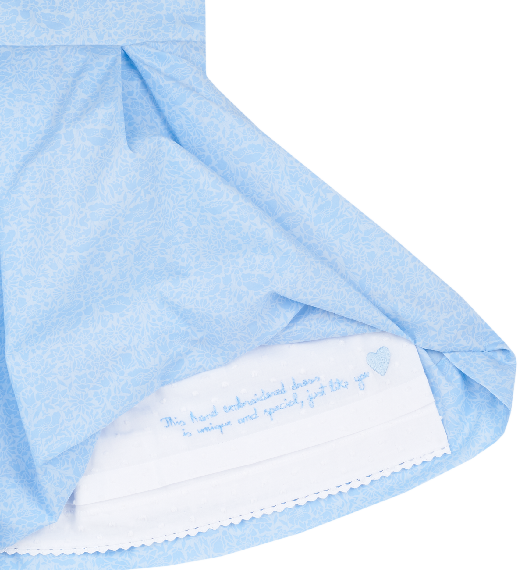 Hidden hand-embroidered message inside girls blue Liberty print dress