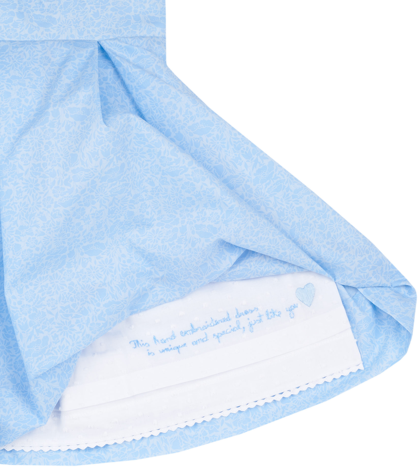 Hidden hand-embroidered message inside girls blue Liberty print dress