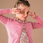 Girls spring outfit with Liberty blouse and cashmere cardigan.