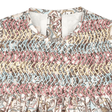 Detail of Jane baby dress hand embroidery and smocked bodice