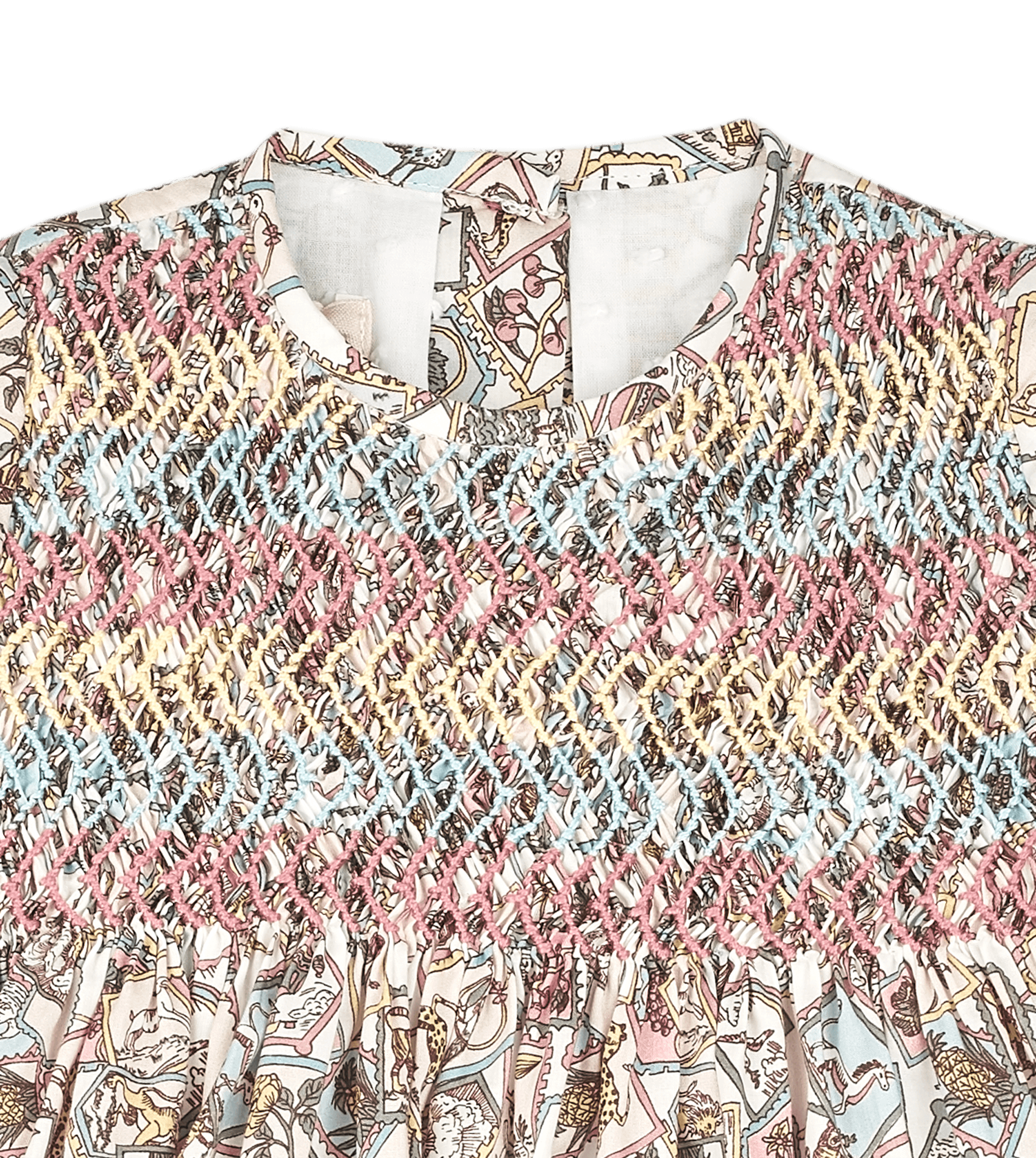 Detail of Jane baby dress hand embroidery and smocked bodice